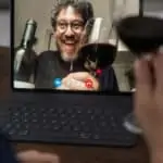 zoom meeting with glass of red wine