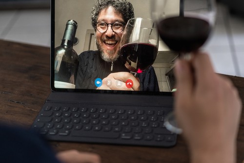 zoom meeting with glass of red wine
